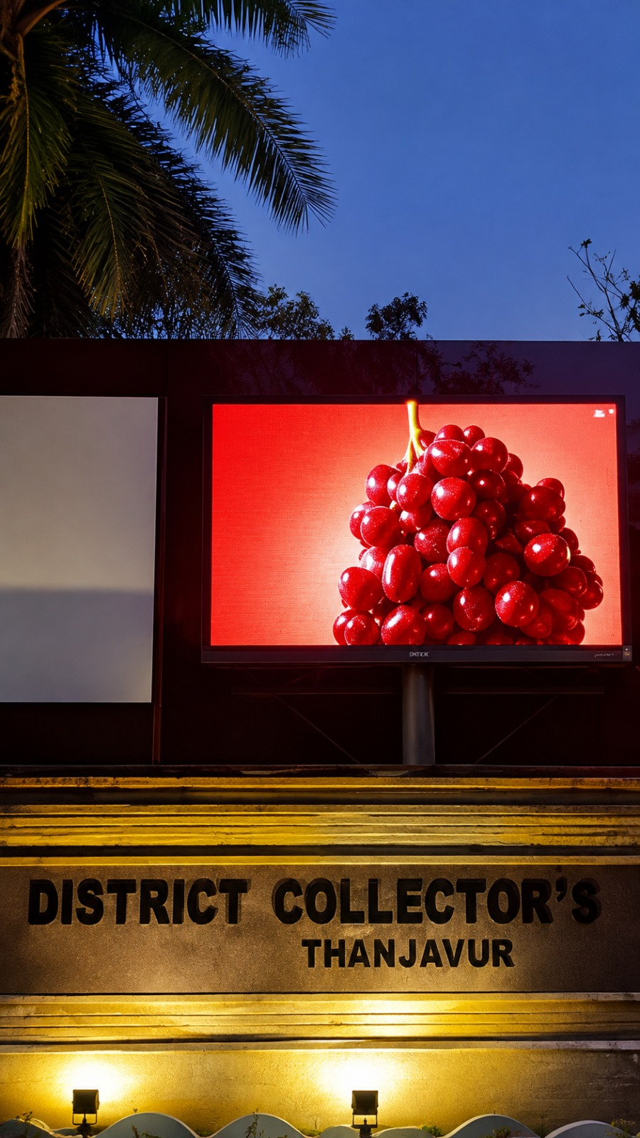 Outdoor LED display at District Collector's office in Thanjavur at dusk